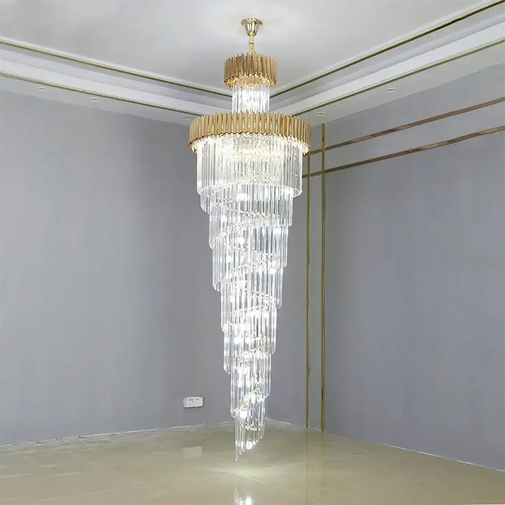 A decorbites crystal led multi-layer staircase chandelier with cascading clear crystal rods and gold-toned metal accents