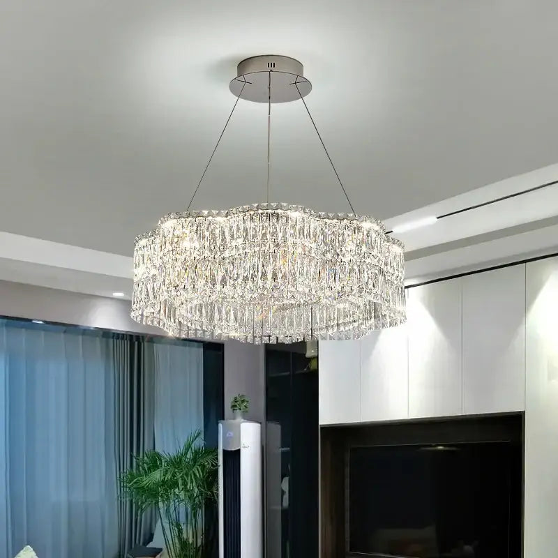 A decorbites crystal luxe multi-tiered gold chandelier with clear crystal prisms for elegant living room lighting