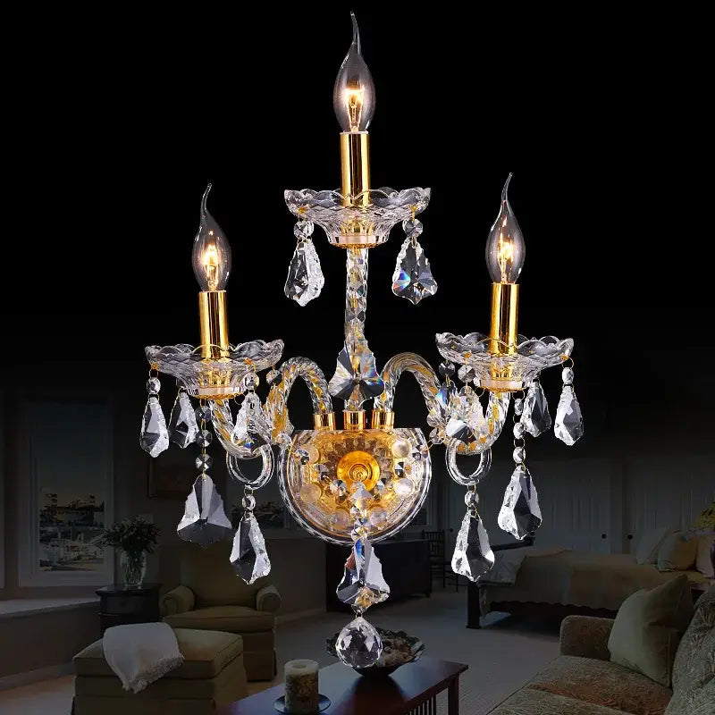 Luxury gold crystal wall lamp with dangling droplets designed for elegant luxury bedroom wall lighting