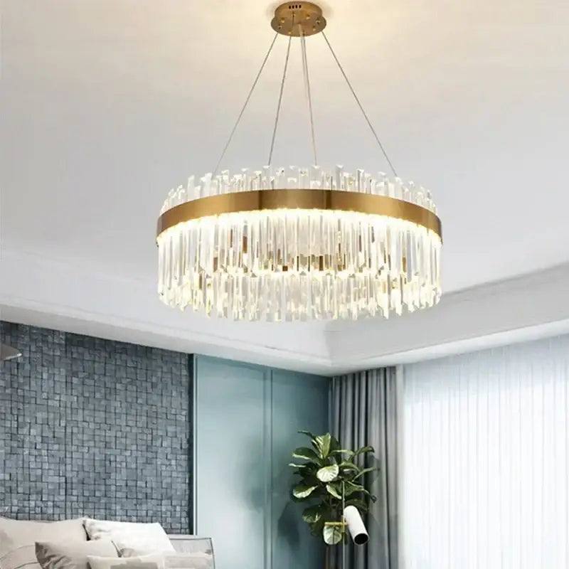 DecorBites™ crystal pendant chandelier with a gold metal frame and clear rods for luxury modest crystal ceiling home decor