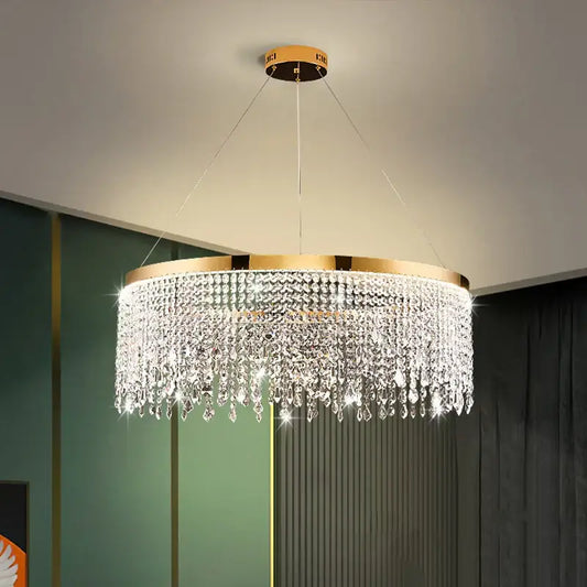 Decorbites crystal waterfall chandelier with gold-toned metal frame and clear crystal droplets for dining room lighting