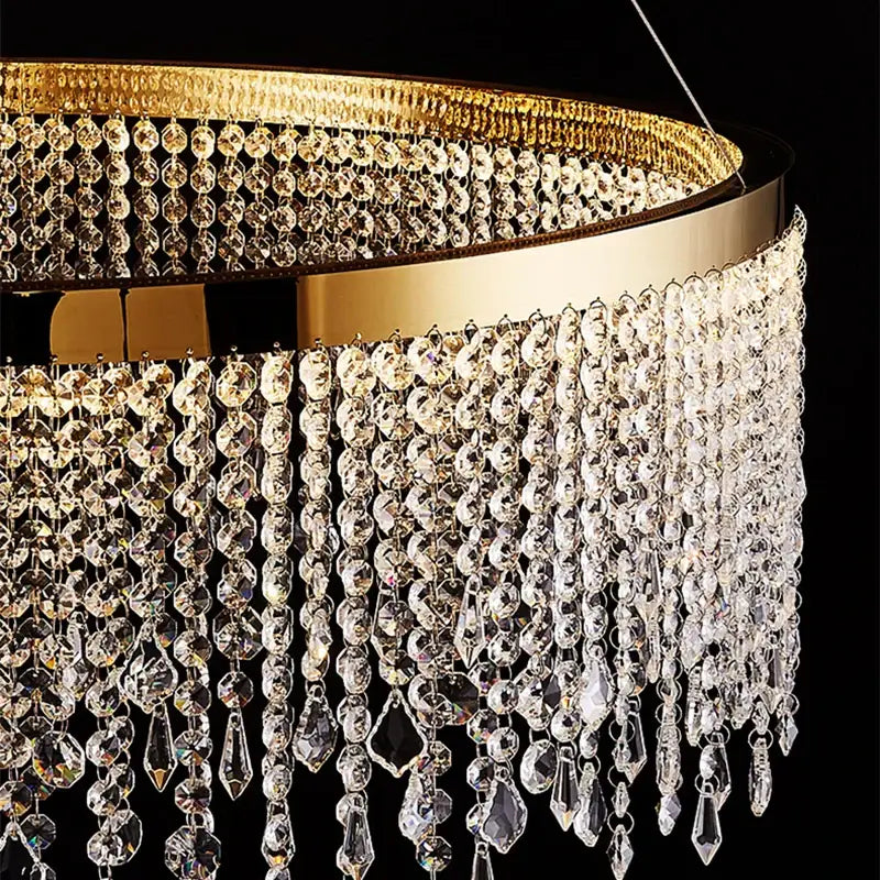 Gold-toned decorbites crystal waterfall chandelier with cascading clear faceted crystal beads for dining room lighting