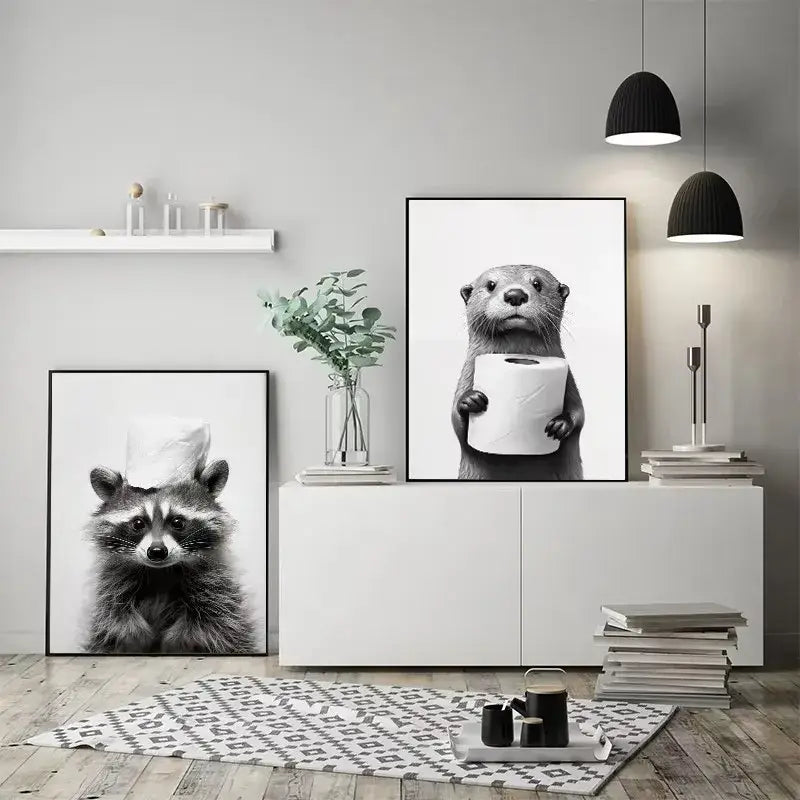Black-and-white framed poster featuring a cute animals canvas with an otter holding toilet paper for bathroom decor