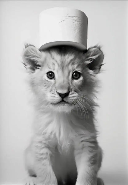 Black-and-white lion cub wearing a toilet paper roll hat on cute animals canvas wall art for bathroom decor