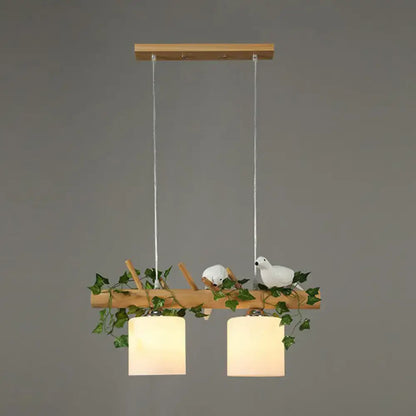 Decorbites™ cylindrical milk glass pendant light with cream shades resin bird deco on rustic wood branch for country style