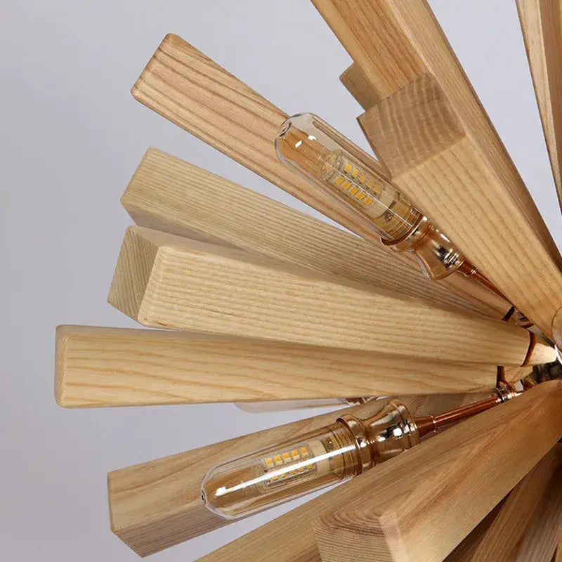 A modern decorbites dandelion wooden pendant light with light wood slats and clear glass led bulbs for dining rooms