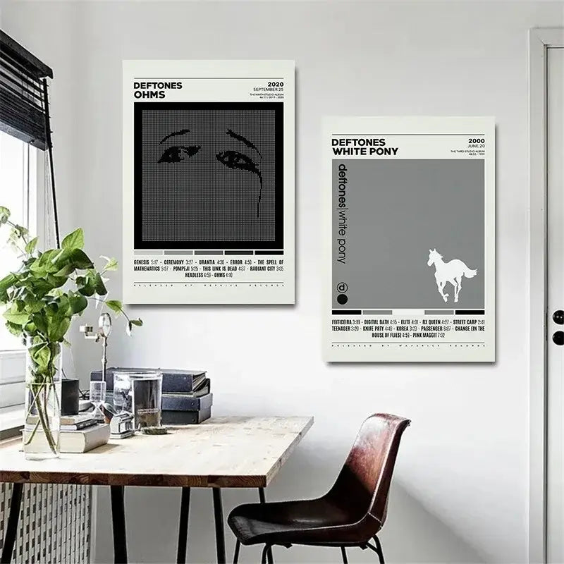 Two minimalist deftones canvas paintings featuring black and white ohms pixelated eye and white pony gray horse designs
