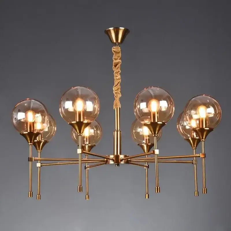 Brass-finished DecorBites™ designer metal chandelier with six glass globes and twisted rope pendant for modern living