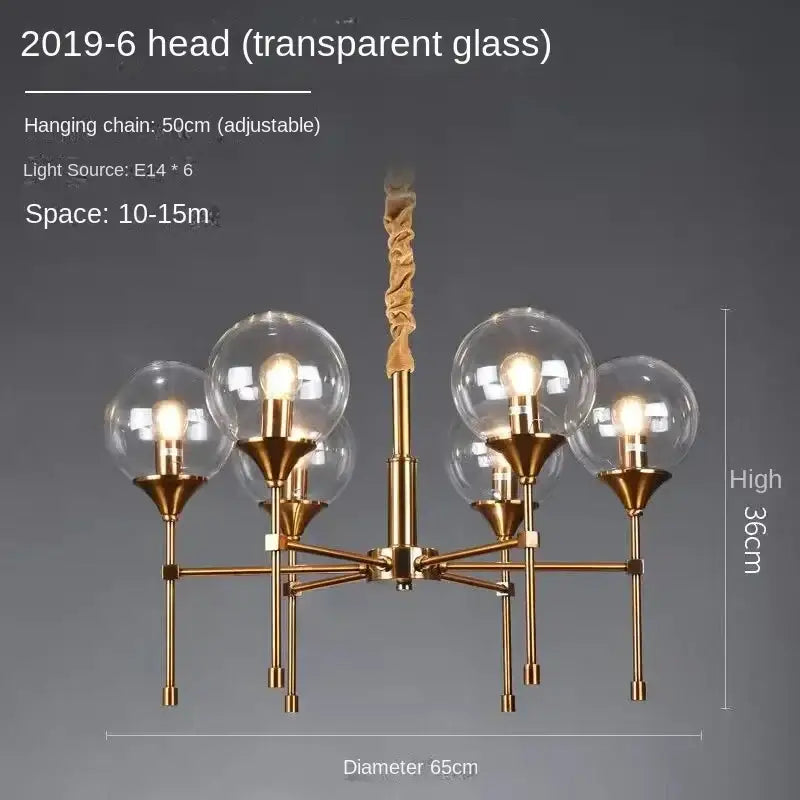 Gold-toned designer metal chandelier with six transparent glass globes and twisted fabric-covered hanging chain for modern living
