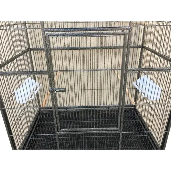 Black metal DecorBites™ dual breeding flight cage with solid door and two white perches for parrots