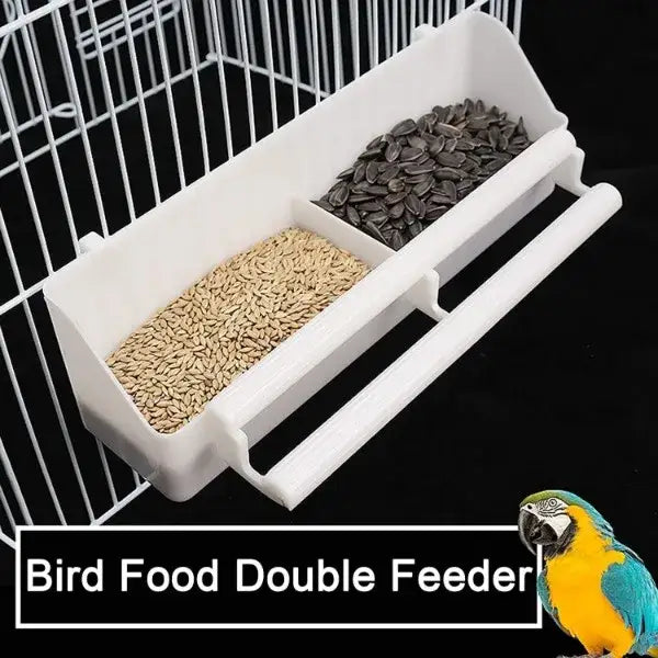 White plastic bird food double feeder with two compartments for sunflower and dark seeds in breeding flight cage
