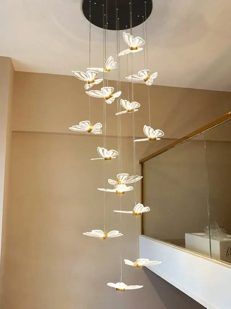 Decorbites elegant butterfly chandelier with translucent white butterfly lights and gold accents for bedroom lighting