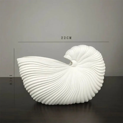 Decorbites™ elegant ceramic vase featuring a sleek white shell conch design with smooth ridged spirals and glossy finish