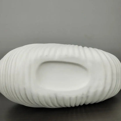 White ceramic elegant ceramic vase with shell conch design featuring ribbed texture and central recessed well