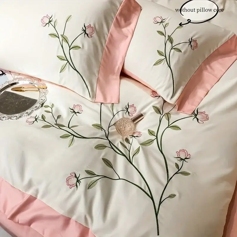 Cream-colored satin embroidery duvet cover with pink rose detailing and blush pink piping from decorbites elegant embroidery set