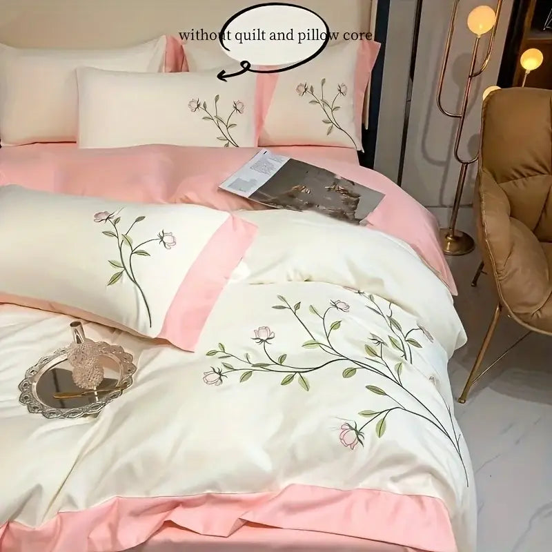 Pink and cream embroidered floral duvet cover set with elegant embroidery and delicate rose motifs by DecorBites