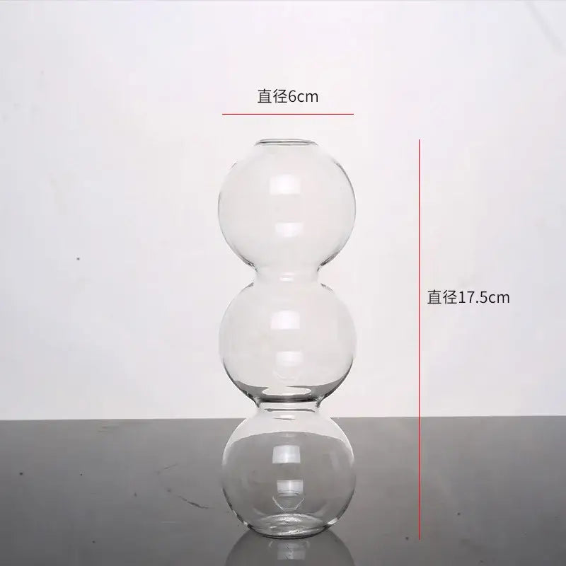 Clear glass vase with three stacked spherical sections elegant glass vase for home decor by DecorBites