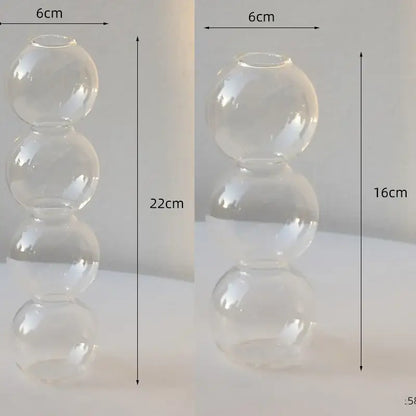 Clear glass vase with three stacked spherical sections elegant glass vase for stylish home decor by DecorBites