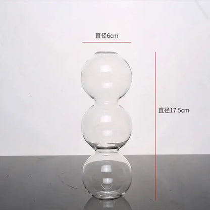 Clear glass vase with three stacked spherical sections from decorbites™ elegant glass vase home decor accent collection