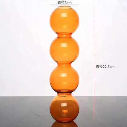 Tall amber glass vase with four stacked spherical sections elegant glass vase for home decor by DecorBites