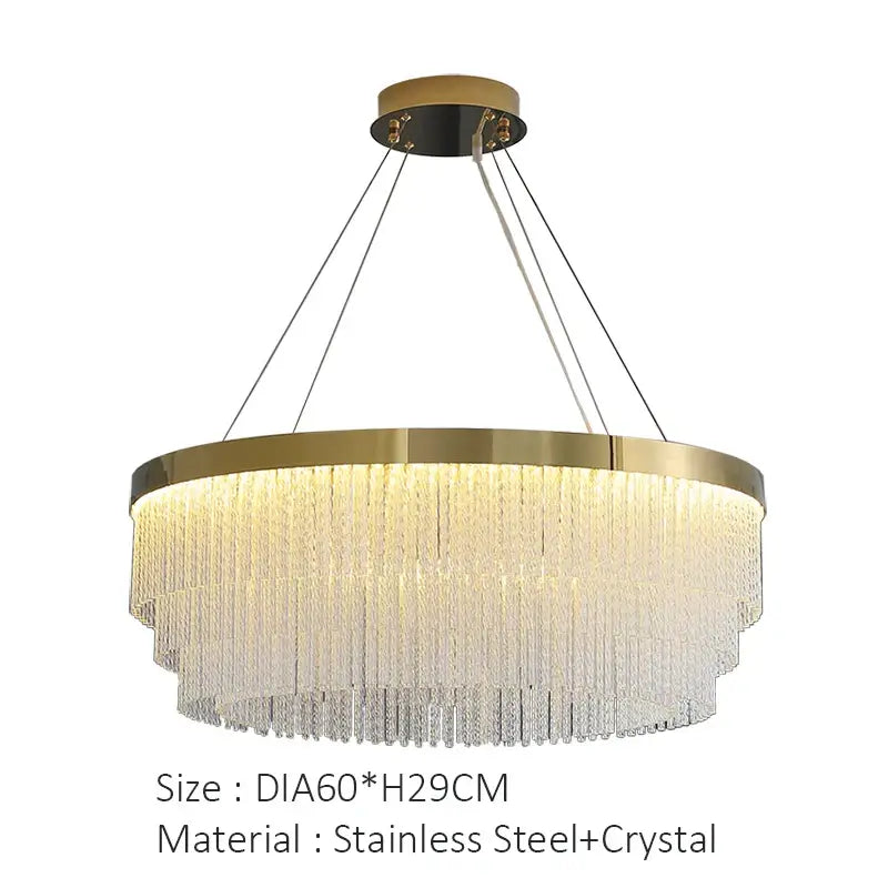 A modern gold luster crystal chandelier with a brushed gold stainless steel frame and cascading crystal strands by decorbites