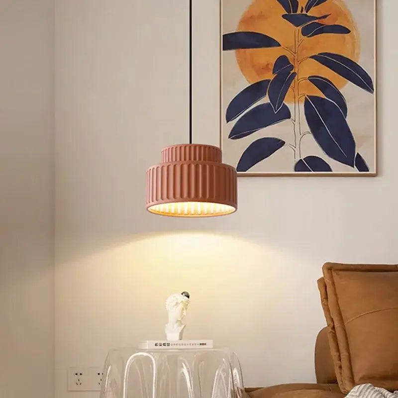 A warm-toned decorbites elegant resin sage green ribbed pendant light with modern design hanging from ceiling