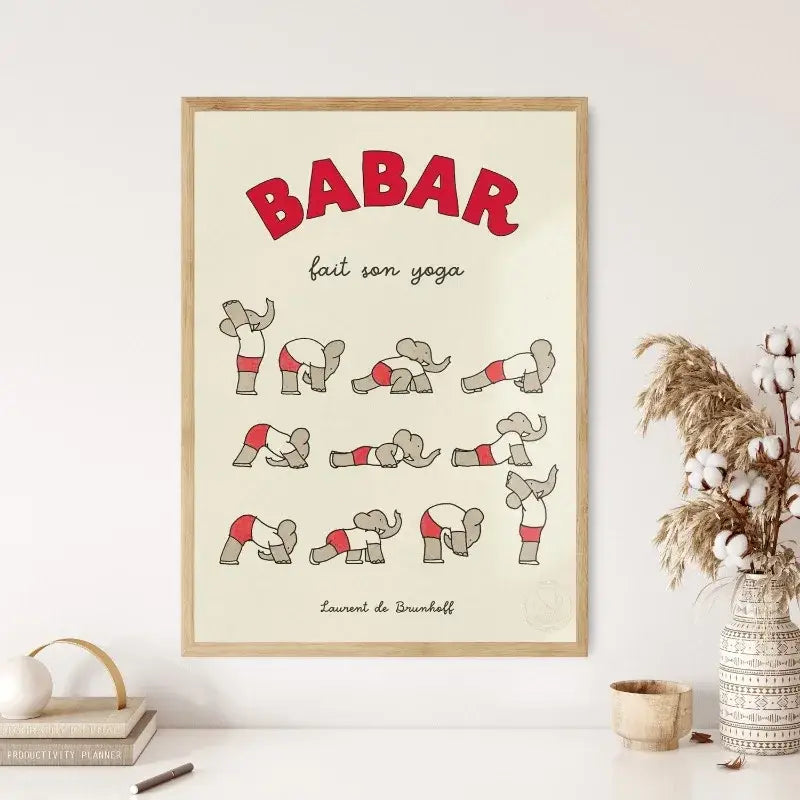 A framed cartoon print of elephant babar family in red and gray doing yoga titled babar fait son yoga for kids room decor