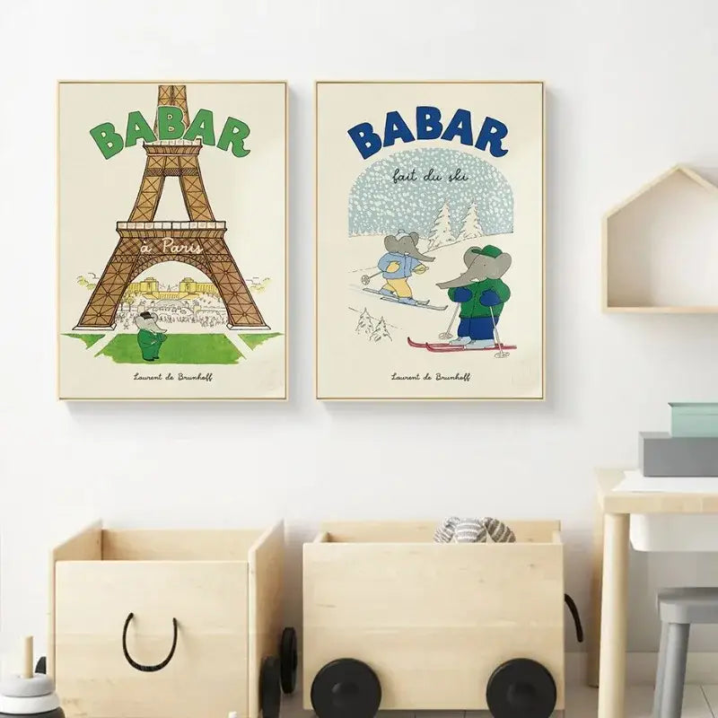 Two framed DecorBites™ elephant cartoon family canvas wall art posters featuring babar in paris and skiing scenes