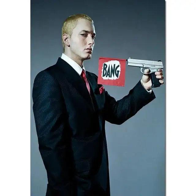 Silver handgun with black grip held by a man in dark suit featured in DecorBites Eminem posters music star wall art