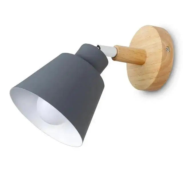 Gray metal eryka wall sconce with wooden base and adjustable arm in modern nordic design for versatile lighting