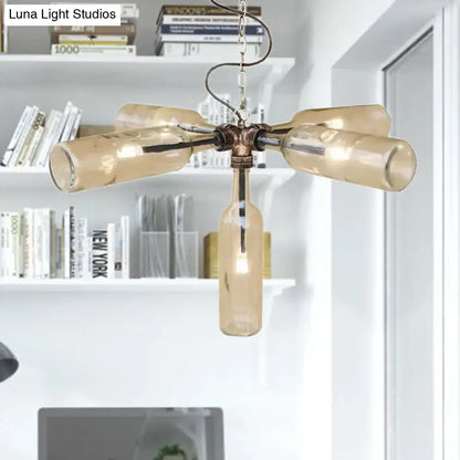 A rustic amber glass bottle chandelier with aged silver black brass frame and smoke gray blue hanging chain lighting fixture