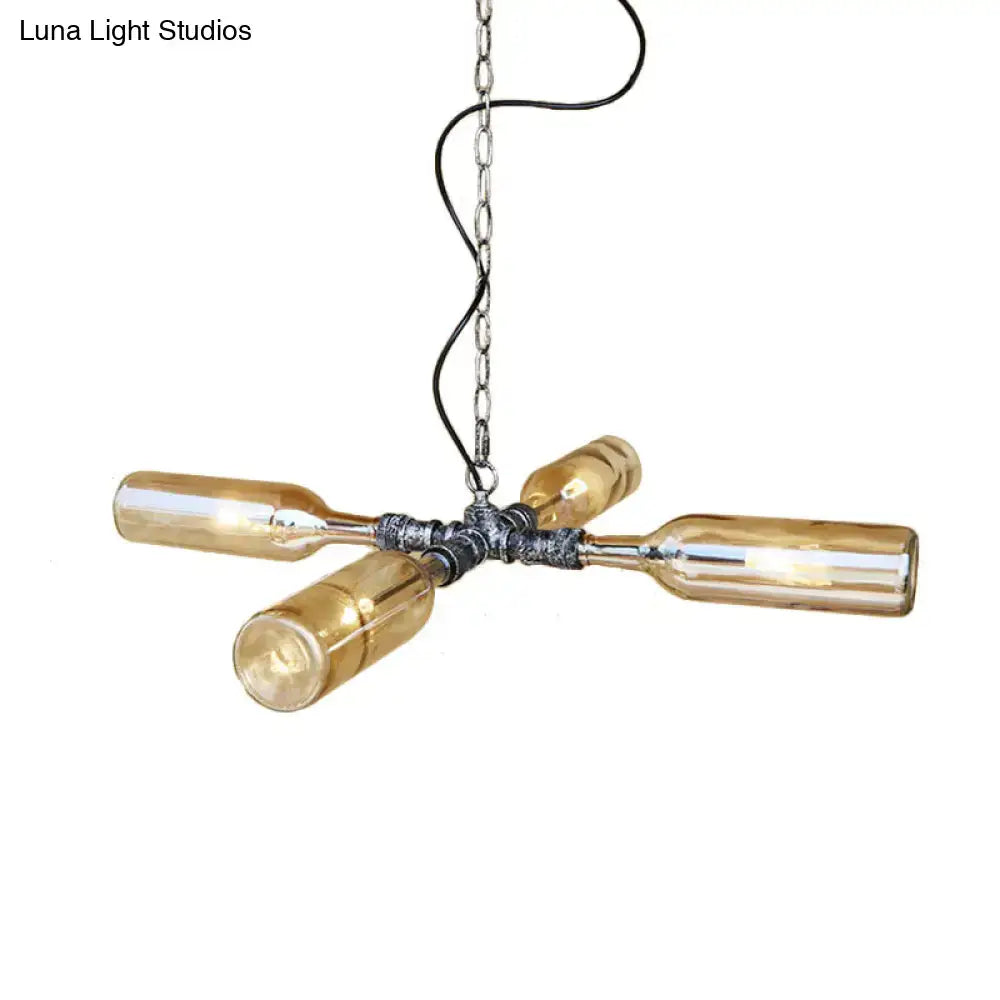 Industrial-style chandelier with four amber smoke gray blue glass bottles on an aged silver black metal hub suspended by chain