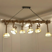 Nautical farmhouse wood bowl pendant lighting with rustic wood beam rope accents and five warm glass shades for restaurants