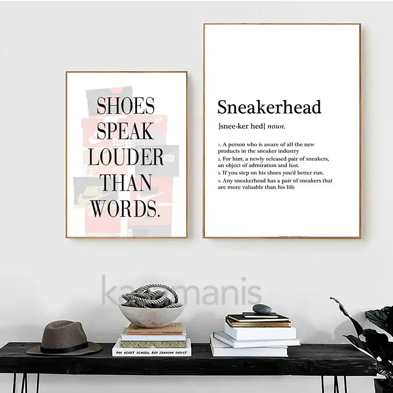 Two framed gold sneaker box canvas wall art prints with minimalist black text on white backgrounds for decorbites wall art