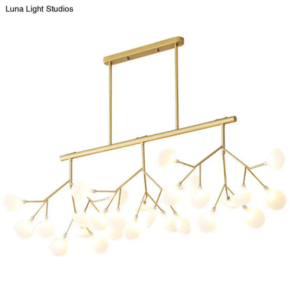 Gold-toned firefly island pendant with branching metal arms and frosted glass globe bulbs for modern restaurant lighting