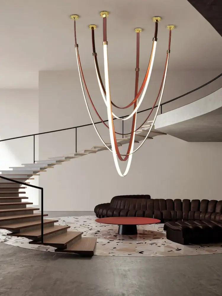 Decorbites™ flexible leather belt led chandelier with multiple curved illuminated tubes and brown cream leather straps