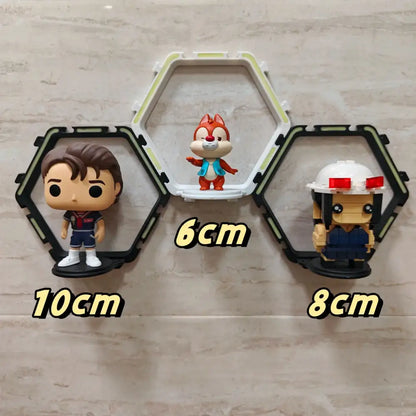 A white hexagonal decorbites™ floating display shelf holding a red and orange chip figurine for collectibles