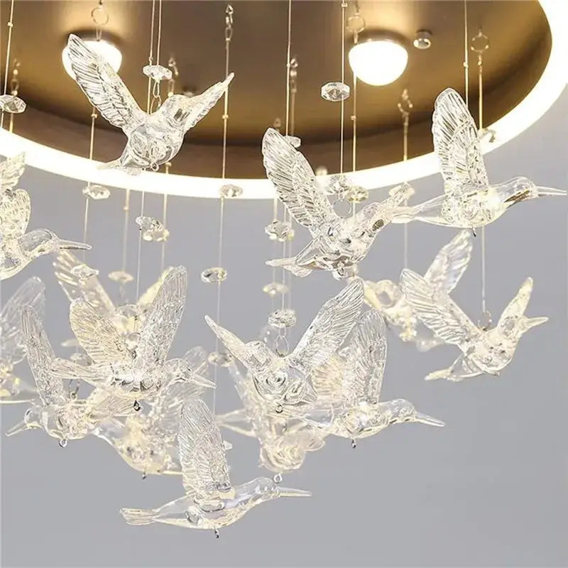Clear glass decorbites flying bird ceiling light with intricate wing details and crystal accents for bedroom use