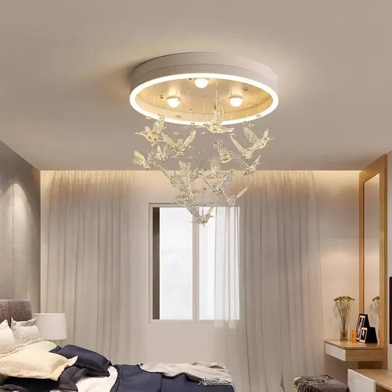 Decorbites flying bird white crystal ceiling light features a modern circular design with hanging crystal bird ornaments