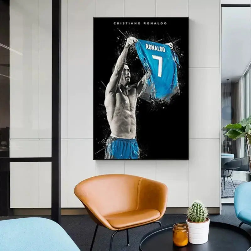 A framed black-and-white football star poster of cristiano ronaldo holding a blue number 7 jersey by DecorBites™