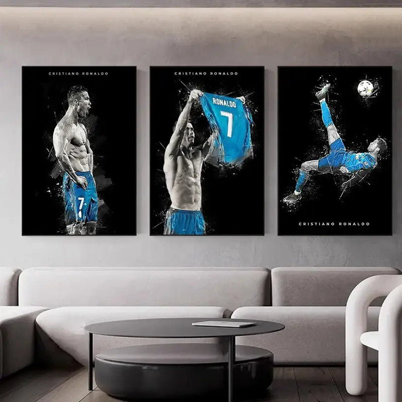 Three framed black and white football star posters featuring cristiano ronaldo in blue jersey displayed above modern sofa