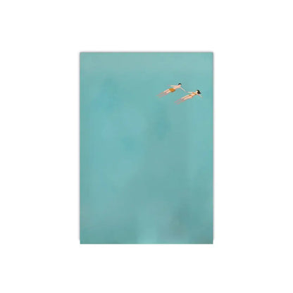 Decorbites frameless summer canvas wall art featuring minimalist teal ocean with two people swimming figures