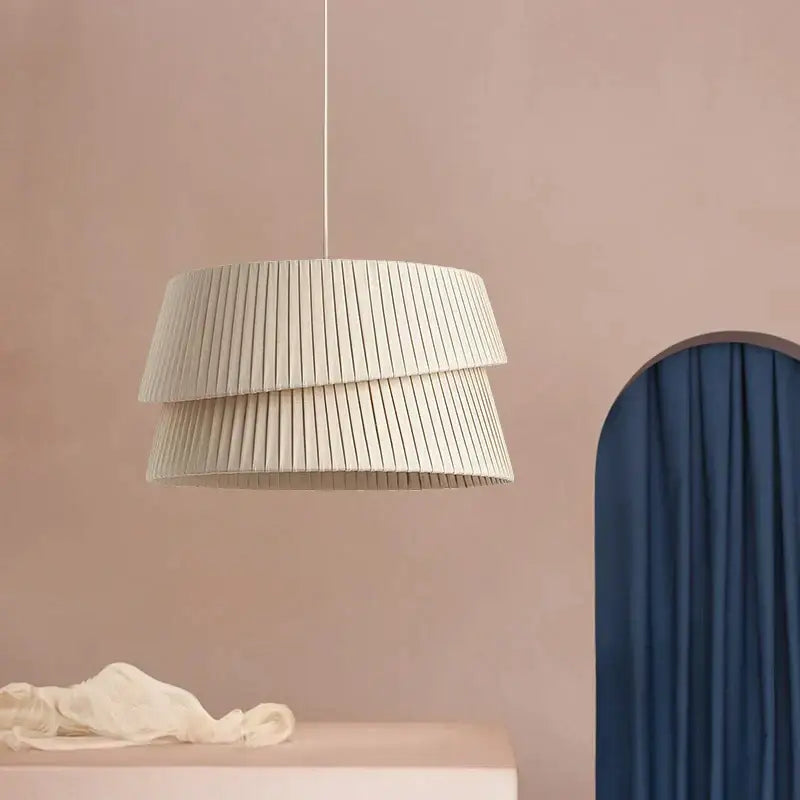 Cream-colored tiered decorbites french cream chandelier with pleated fabric and minimalist design for bedroom lighting