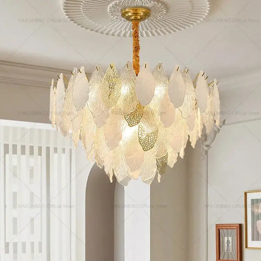Elegant gold-toned decorbites french crystal chandelier with cascading translucent leaf-shaped glass panels for living room lighting