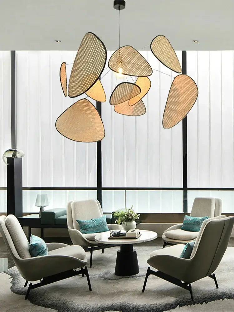 Modern beige woven rattan chandelier with organic leaf shapes in french design for the french design market lighting