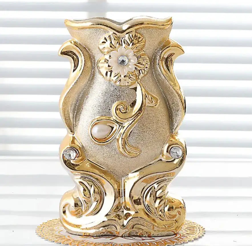 Gold-colored ornate frosted porcelain flower vase with floral scrollwork, pearl beads, and crystal accents for home decor