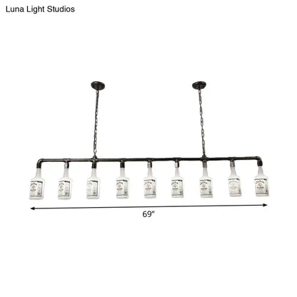 Industrial-style black pipe chandelier with ten clear glass black wine bottle lights featuring frosted white glass labels