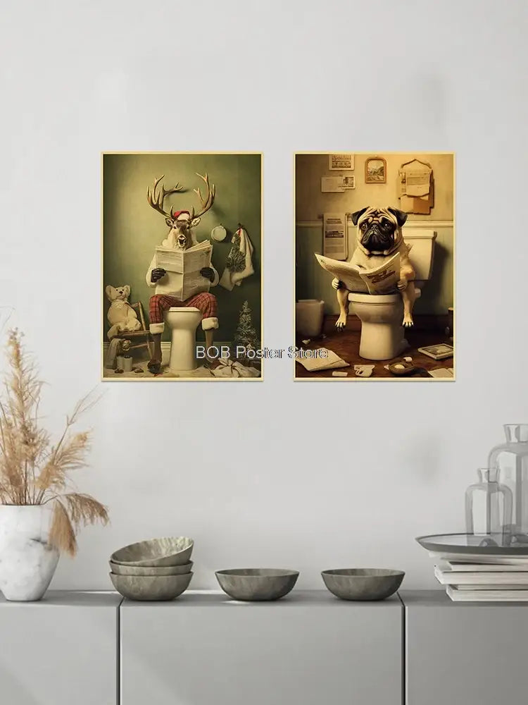 Two framed sepia-toned vintage-style posters featuring a deer and pug in holiday attire reading on toilets for funny animal bathroom home decor