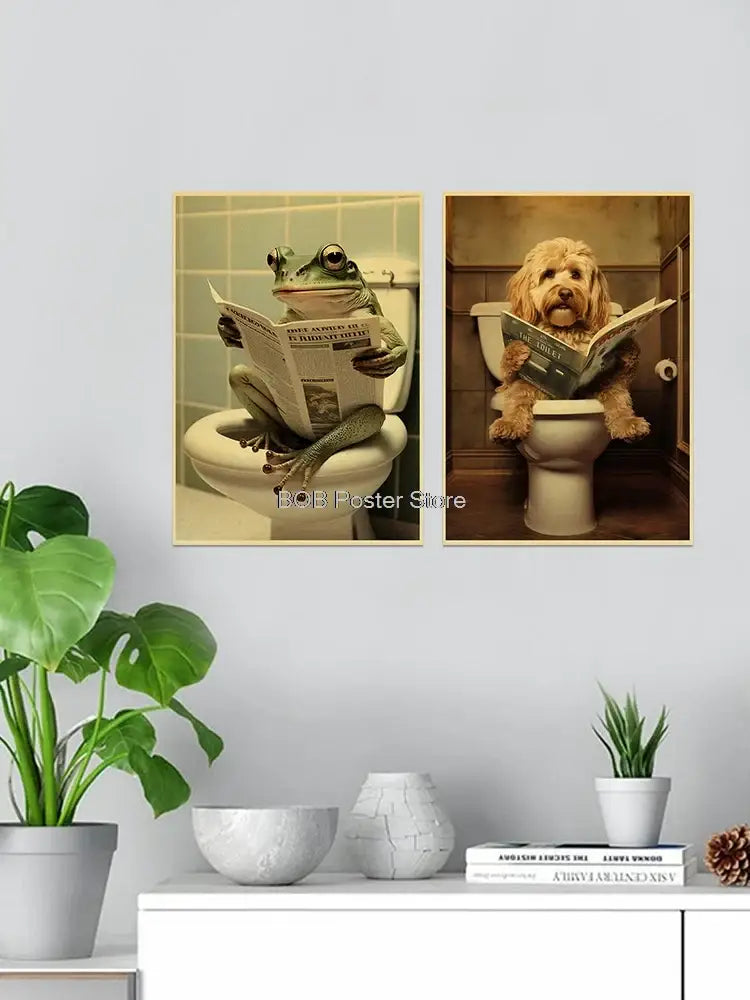 Two framed canvas prints of a green frog and a fluffy dog reading newspapers on toilets for funny animal bathroom decor