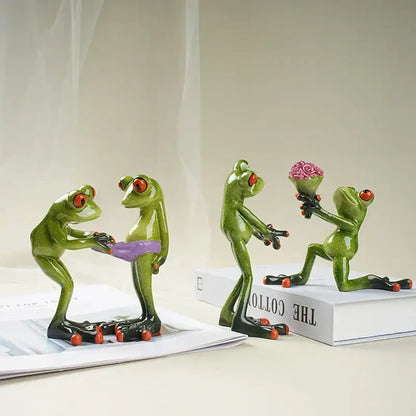 Green resin frog couple figurine with red eyes holding a purple bikini and pink rose bouquet decorbites funny frog